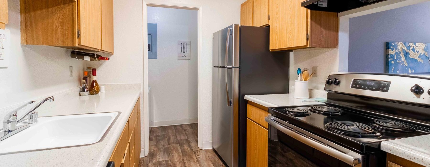 a kitchen with wooden cabinets