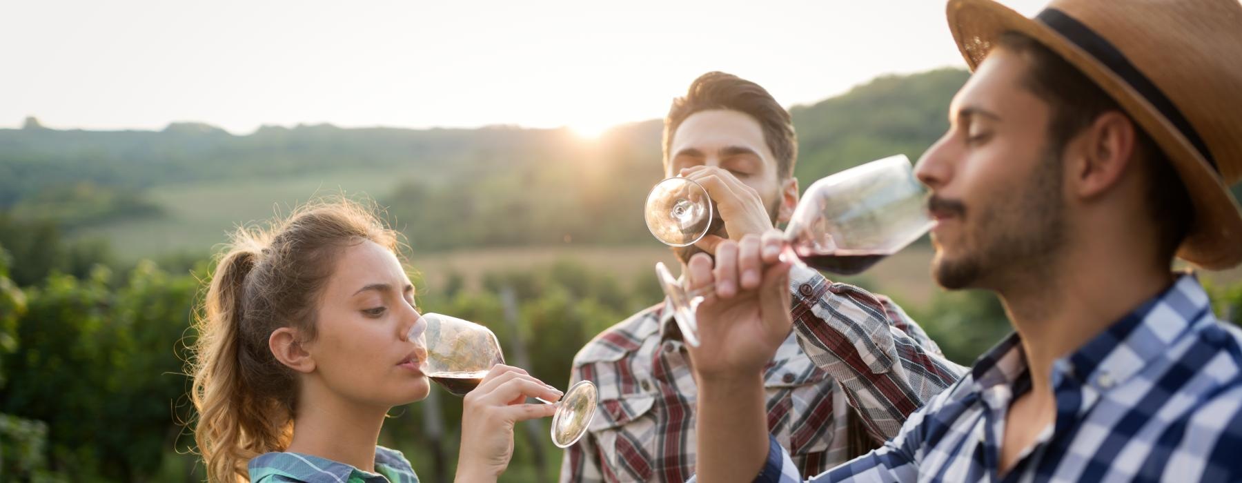a group of people drinking from glasses